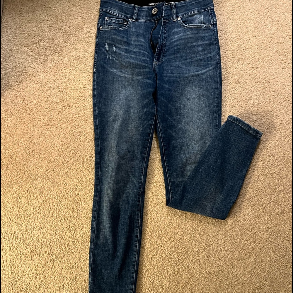 INC sculpting fit jeans .